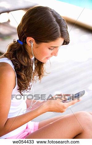 brunette, cell phone, adolescence View Large Photo Image Stock Image - brunette, cell phone, adolescence. Fotosearch