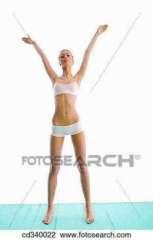 Stock Image - brunette, contemporary, Arms raised. Fotosearch