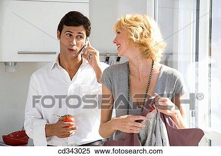 Stock Photography - calling, cell phone, at-home. Fotosearch