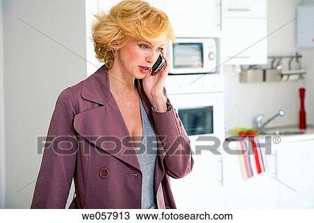 calling, coat, cell phone, at-home View Large Photo Image Stock Image - calling, coat, cell phone, at-home. Fotosearch