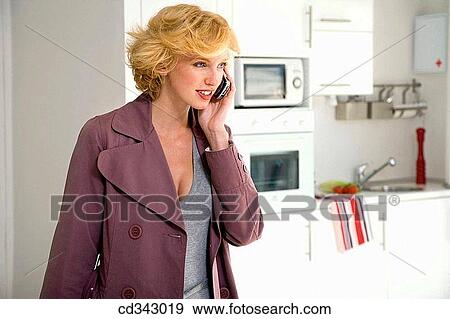 calling, coat, cell phone, at-home View Large Photo Image Stock Photo - calling, coat, cell phone, at-home. Fotosearch