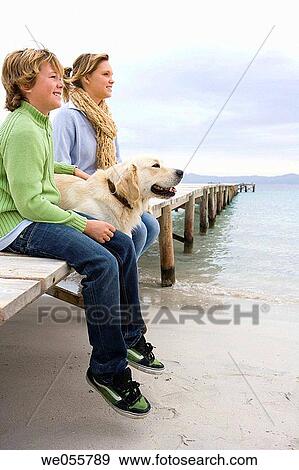 calm, autumn, brother, boy, beach, animal View Large Photo Image Stock Photo - calm, autumn, brother, boy, beach, animal. Fotosearch
