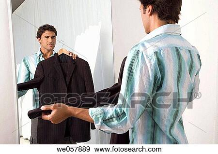 Stock Photo - changing-room, choice, choosing, Clothing store. Fotosearch