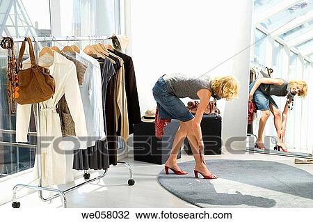 Stock Image - changing-room, choosing, choice, accessory. Fotosearch