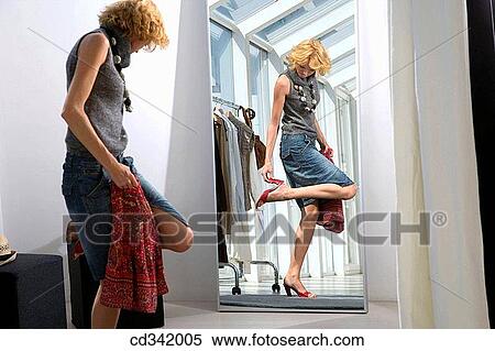 Stock Photography - changing-room, choosing, choice, accessory. Fotosearch