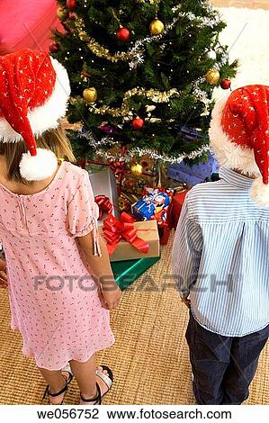 Stock Image - child, back view, brother, boy, bauble, at-home. Fotosearch