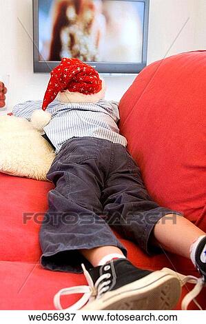 Stock Photo - Christmas, at-home, child, boy, back view, addiction. Fotosearch