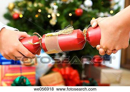 Stock Photo - Christmas Cracker, celebrate, Christmas, child, celebration, at-home. Fotosearch