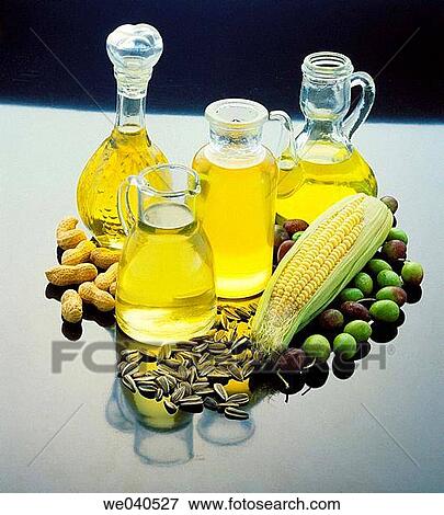Stock Photo - Corn, olive, sunflower and peanut oils. Fotosearch