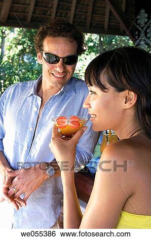 couple talking and drinking at bar View Large Photo Image Stock Photograph - couple talking and drinking at bar. Fotosearch