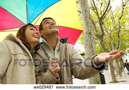 Couple under an umbrella. Alameda del Boulevard. San Sebastißn-Donostia. Guip·zcoa. Euskadi. Spain View Large Photo Image Stock Photo - Couple under an umbrella. Alameda del Boulevard. San Sebastißn-Donostia. Guip·zcoa. Euskadi. Spain. Fotosearch