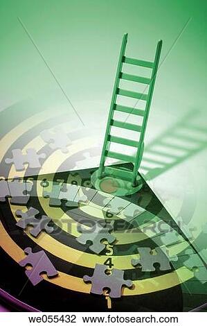 Photo Combination of Miniature Ladder and Jigsaw Puzzle Pieces on Dartboard View Large Photo Image Stock Image - Photo Combination of Miniature Ladder and Jigsaw Puzzle Pieces on Dartboard. Fotosearch