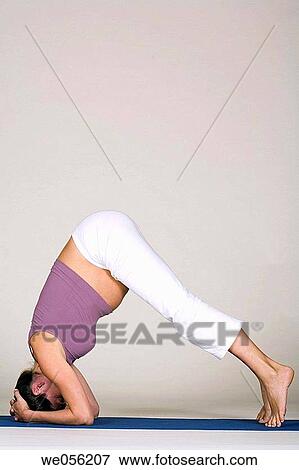 Stock Photo - Pregnant Woman Doing Yoga. Fotosearch