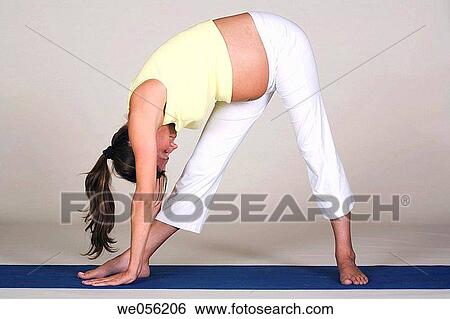 Stock Photograph - Pregnant Woman Doing Yoga. Fotosearch