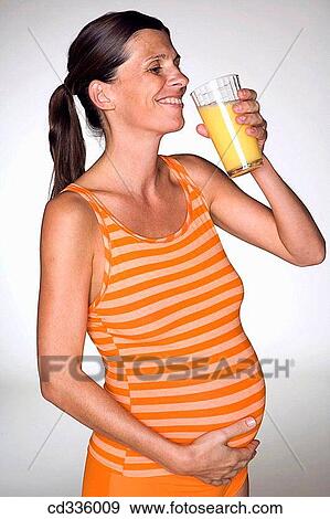 Pregnant Woman Drinking Juice View Large Photo Image Stock Photo - Pregnant Woman Drinking Juice. Fotosearch