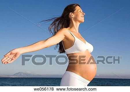 Stock Photo - Pregnant Woman Enjoying Life. Fotosearch