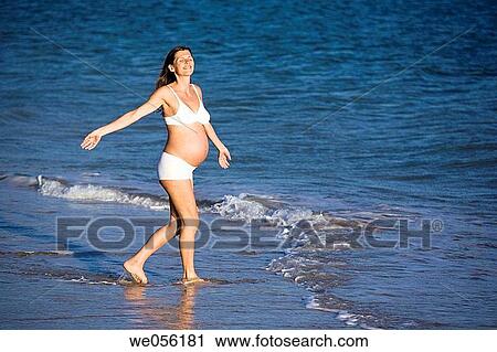 Pregnant Woman Enjoying the Sea Shore View Large Photo Image Stock Image - Pregnant Woman Enjoying the Sea Shore. Fotosearch