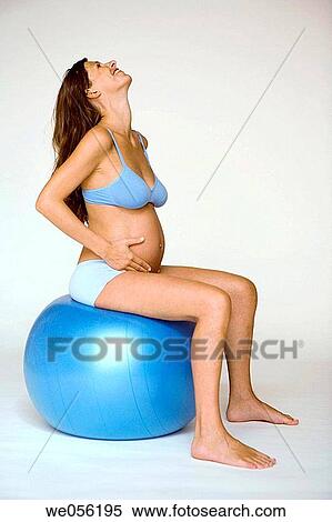 Pregnant Woman Exercises on a Ball View Large Photo Image Stock Photography - Pregnant Woman Exercises on a Ball. Fotosearch