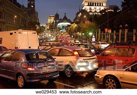 Stock Image - Rain and traffic. Cibeles square. Puerta de Alcala. Madrid. Spain. Fotosearch