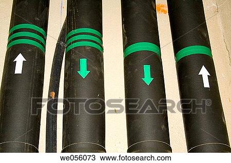 Signs on pipes View Large Photo Image Stock Image - Signs on pipes. Fotosearch