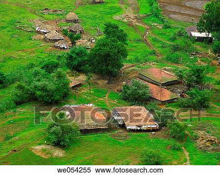 Small huts with sloping roof made of manglori tiles and agricultural land at rural area near Nilkantheshwar, Donje, Pune, Maharashtra, India View Large Photo Image Stock Photography - Small huts with sloping roof made of manglori tiles and agricultural land at rural area near Nilkantheshwar, Donje, Pune, Maharashtra, India. Fotosearch
