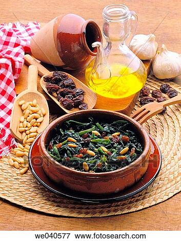 Stock Photo - Spinach in Catalan style with raisins and nuts. Fotosearch