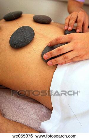 Stock Photograph - Stone massage. Fotosearch