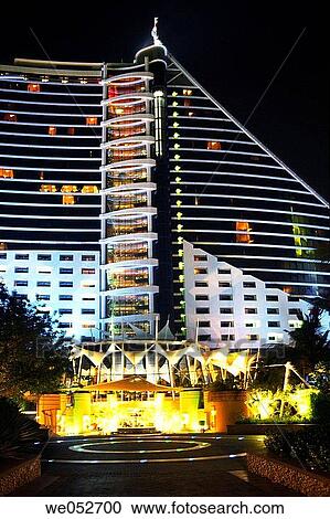 The Jumeirah Beach Resort 5 star luxury hotel by night at Jumeirah Beach, Dubai, United Arab Emirates View Large Photo Image Stock Image - The Jumeirah Beach Resort 5 star luxury hotel by night at Jumeirah Beach, Dubai, United Arab Emirates. Fotosearch