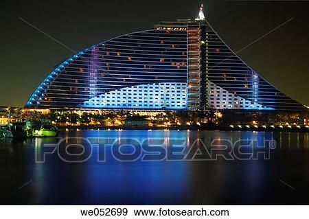 The Jumeirah Beach Resort 5 star luxury hotel by night seen from the 360 Degree Bar on the Marina roofdeck, at Jumeirah Beach, Dubai, United Arab Emirates View Large Photo Image Stock Photo - The Jumeirah Beach Resort 5 star luxury hotel by night seen from the 360 Degree Bar on the Marina roofdeck, at Jumeirah Beach, Dubai, United Arab Emirates. Fotosearch