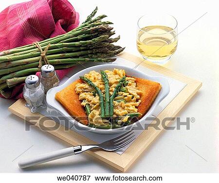 Stock Photo - Wild asparagus in scrambled eggs. Fotosearch