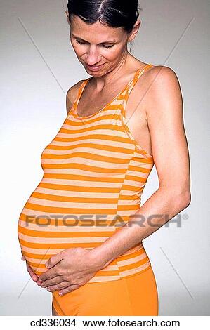 Picture - Woman Enjoying Her Pregnancy. Fotosearch