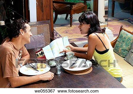 young couple having breakfast and planning for vacation View Large Photo Image Stock Photo - young couple having breakfast and planning for vacation. Fotosearch