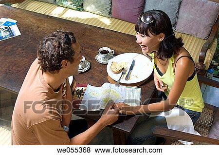 young couple having breakfast and planning for vacation View Large Photo Image Stock Photo - young couple having breakfast and planning for vacation. Fotosearch