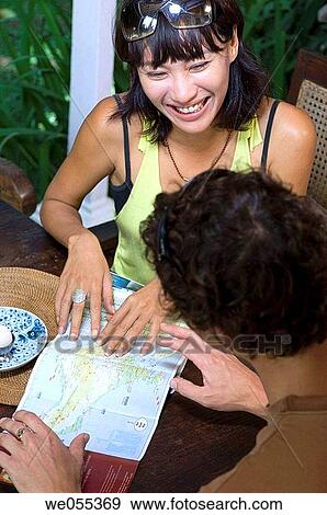 young couple having breakfast and planning for vacation View Large Photo Image Stock Photo - young couple having breakfast and planning for vacation. Fotosearch