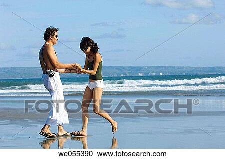 young couple having fun on the beach View Large Photo Image Stock Image - young couple having fun on the beach. Fotosearch