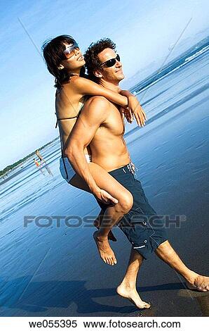 young couple having fun on the beach View Large Photo Image Stock Photography - young couple having fun on the beach. Fotosearch