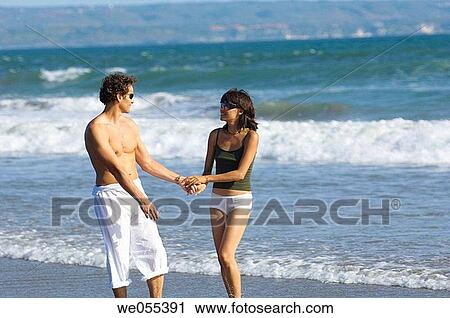 young couple outing on the beach View Large Photo Image Stock Image - young couple outing on the beach. Fotosearch