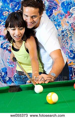 young couple playing billiard View Large Photo Image Stock Image - young couple playing billiard. Fotosearch