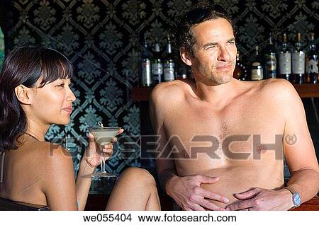 young couple relaxing at bar View Large Photo Image Picture - young couple relaxing at bar. Fotosearch