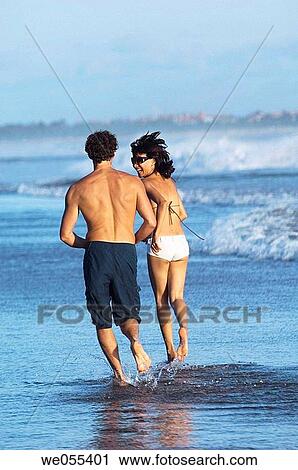 young couple running on the beach View Large Photo Image Stock Image - young couple running on the beach. Fotosearch