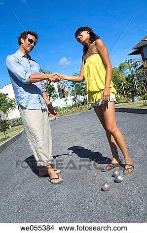 young couple shaking hands View Large Photo Image Picture - young couple shaking hands. Fotosearch