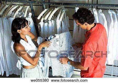 Stock Image - young couple shopping at store. Fotosearch
