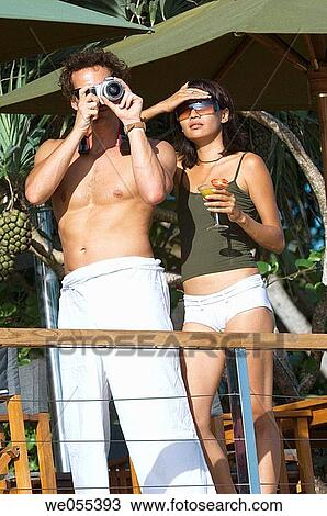 young tourist couple taking snapshot View Large Photo Image Stock Image - young tourist couple taking snapshot. Fotosearch