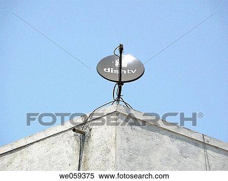 A dish antenna of a television set on a building terrace. Pune, Maharashtra, India. View Large Photo Image Stock Photography - A dish antenna of a television set on a building terrace. Pune, Maharashtra, India.. Fotosearch
