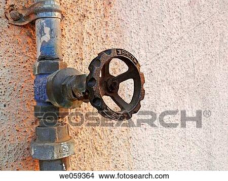 A revolving cock, tap of a water pipeline going to an overhead water storage on a building teracce. Vadgaon Budruk. Pune, Maharashtra, India. View Large Photo Image Picture - A revolving cock, tap of a water pipeline going to an overhead water storage on a building teracce. Vadgaon Budruk. Pune, Maharashtra, India.. Fotosearch
