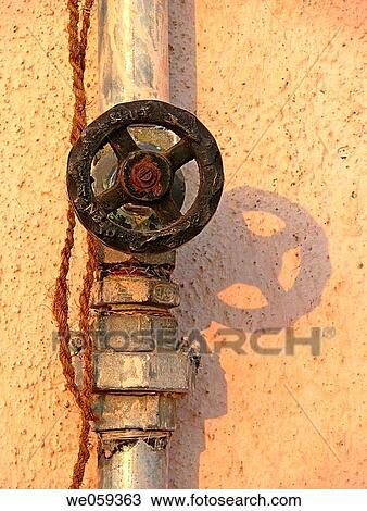 A revolving cock, tap of a water pipeline going to an overhead water storage on a building teracce. Vadgaon Budruk. Pune, Maharashtra, India. View Large Photo Image Stock Image - A revolving cock, tap of a water pipeline going to an overhead water storage on a building teracce. Vadgaon Budruk. Pune, Maharashtra, India.. Fotosearch
