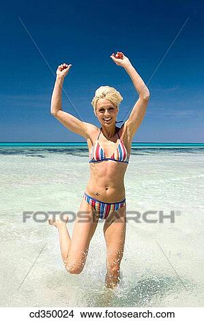activity, beach, Arms raised, amusement, action View Large Photo Image Picture - activity, beach, Arms raised, amusement, action. Fotosearch