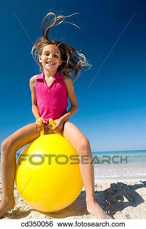 Stock Photograph - activity, beach, ball, amusement, action. Fotosearch