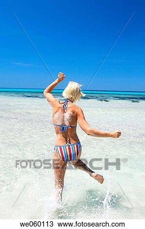 Stock Image - agile, Arms raised, amusement, agility, action. Fotosearch