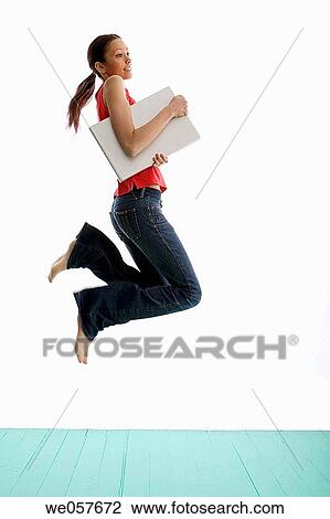 Stock Image - agile, brunette, barefoot, agility, action. Fotosearch